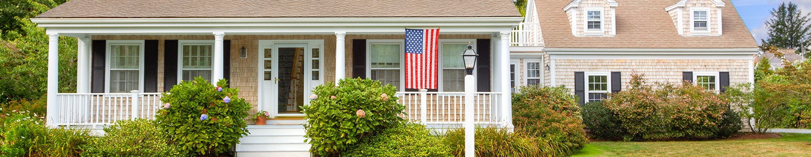 Home with American Flag hanging out front
